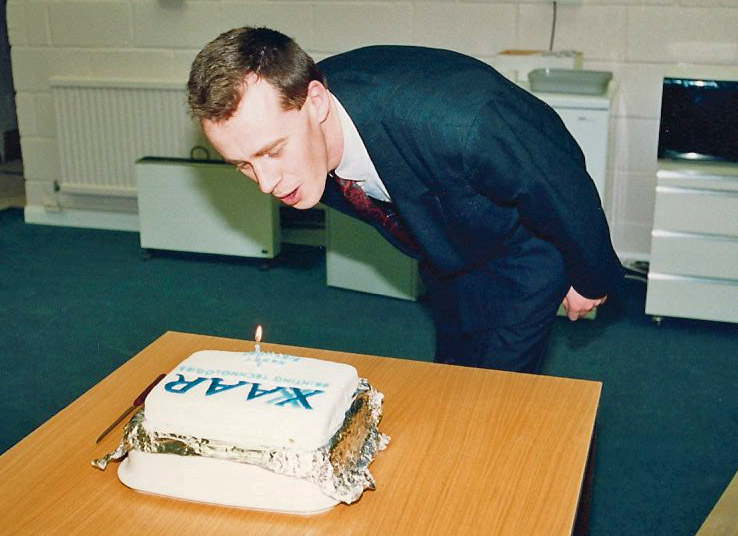Xaar 1st birthday celebration. Mark Shepherd one of Xaars founder members pictured blowing out the candle